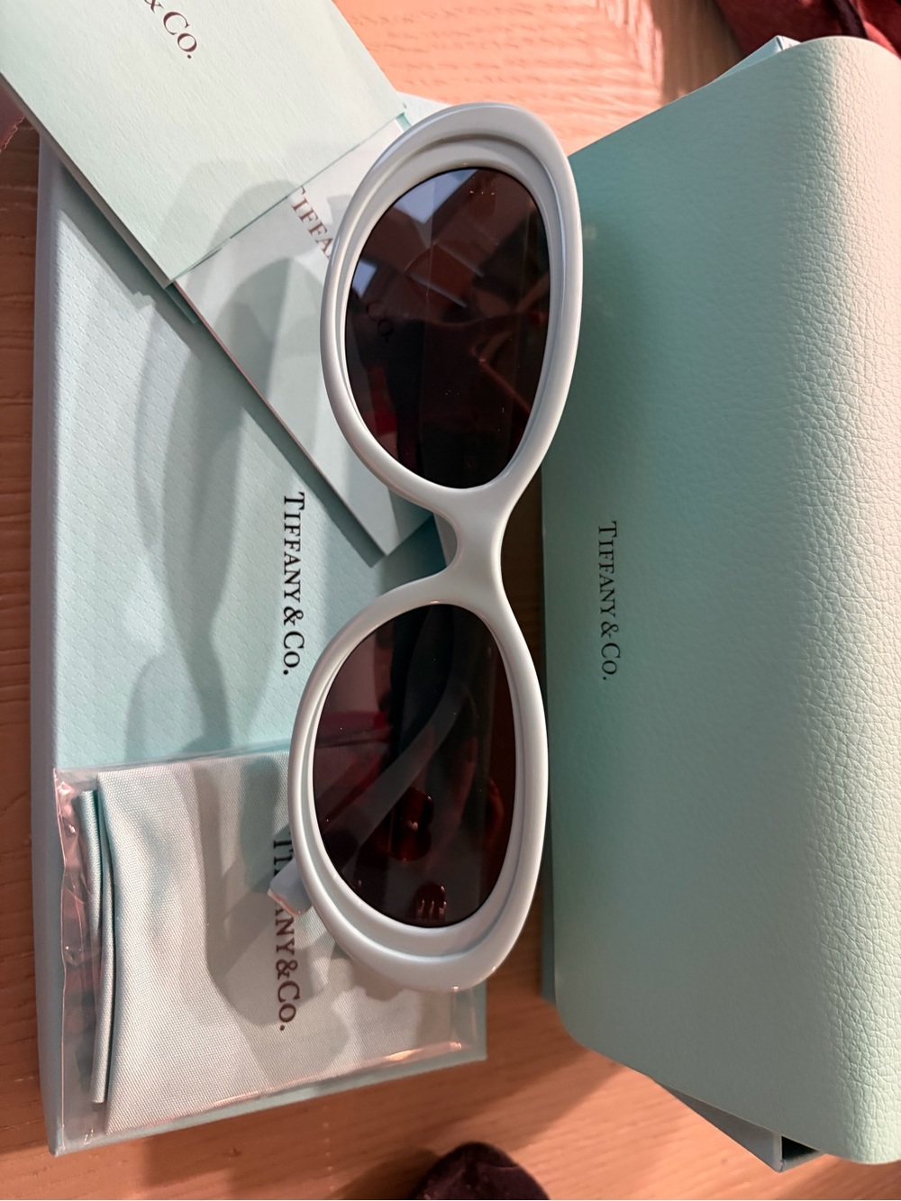 Tiffany & Co. White Oval Frame Sunglasses with Dark Lenses